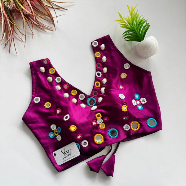 Festive Fashion: Designer Sleeveless Blouse with Heavy Mirror Work & Unique Pattern for Navratri